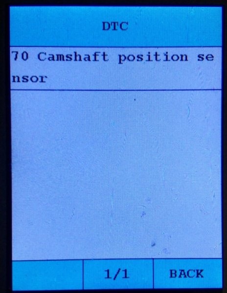 Navigating the menu on the C110 OBD2 scanner to read diagnostic codes