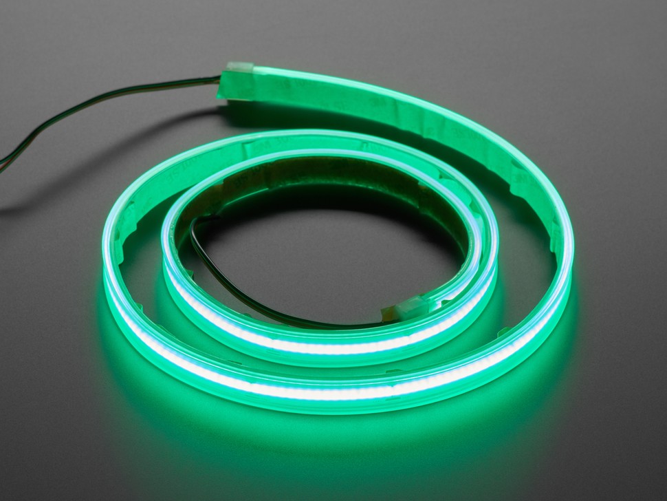 Close-up of an Adafruit OBD2 to DE-9 adapter cable, showcasing its simple yet effective design for connecting to a car's OBD2 port