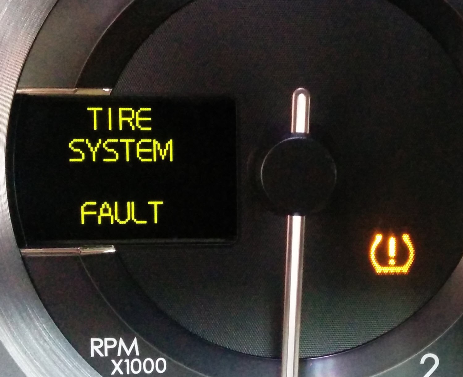 Aston Martin dash displaying TPMS system fault warning