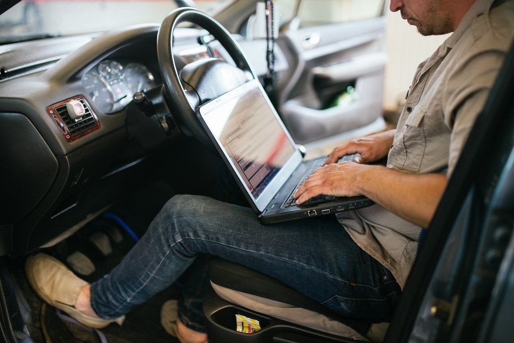 OBD2 scanner connected to a car's diagnostic port