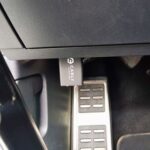 Carly OBD II scanner installed in a car
