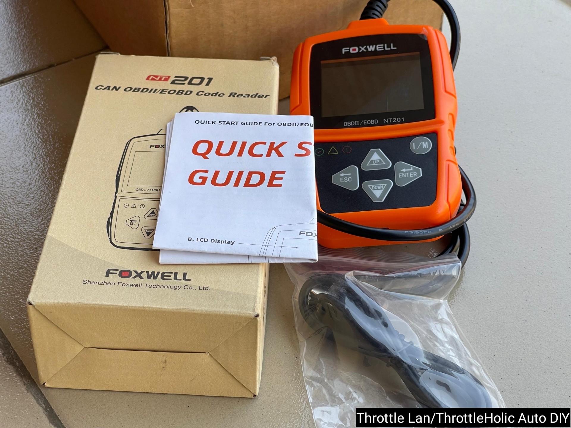 What’s in the Box of the Foxwell NT201 Code Reader?