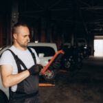 Mechanic Using Tablet On Car