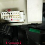 OBD2 diagnostic tool connected to a car's OBD2 port