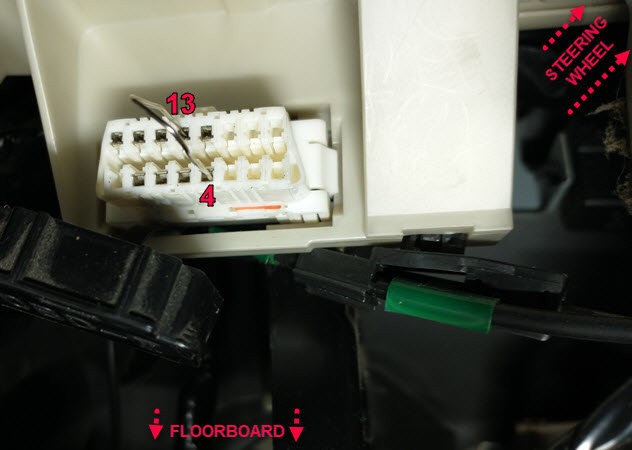 OBD2 diagnostic tool connected to a car's OBD2 port