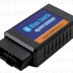 ELM327 Bluetooth OBD2 adapter connected to a car's OBD2 port