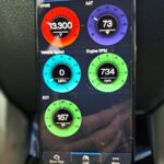 BlueDriver OBD2 scanner connected to a car's OBD2 port
